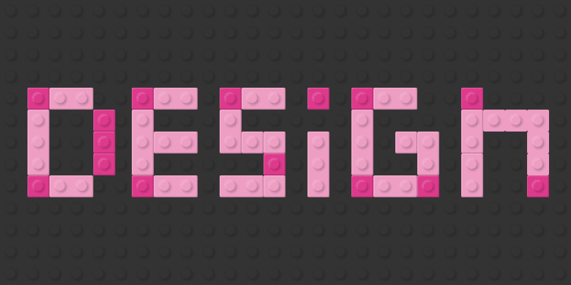 The word DESIGN spelled out in pink Lego bricks on a dark baseplate